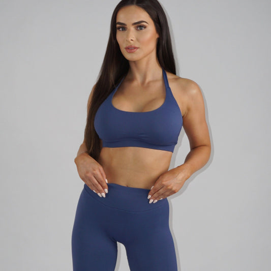 Sapphire blue full-length leggings with a low-rise elastic waistband, seamless design, and lightweight, breathable spandex-nylon fabric for comfort and style.