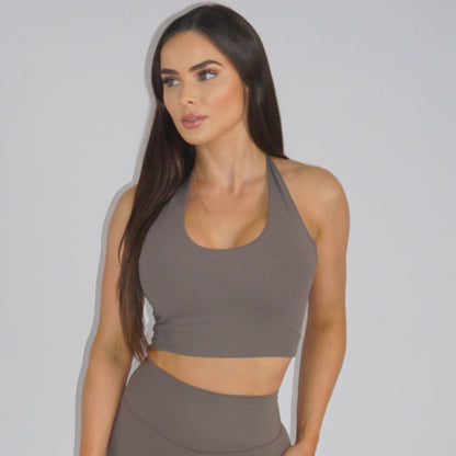 Seamless halter top in Timeless Taupe, crafted with buttery-soft fabric, non-removable padding, and a seamless design for all-day comfort and elegance.